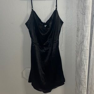 Shiny little black dress with open bow back